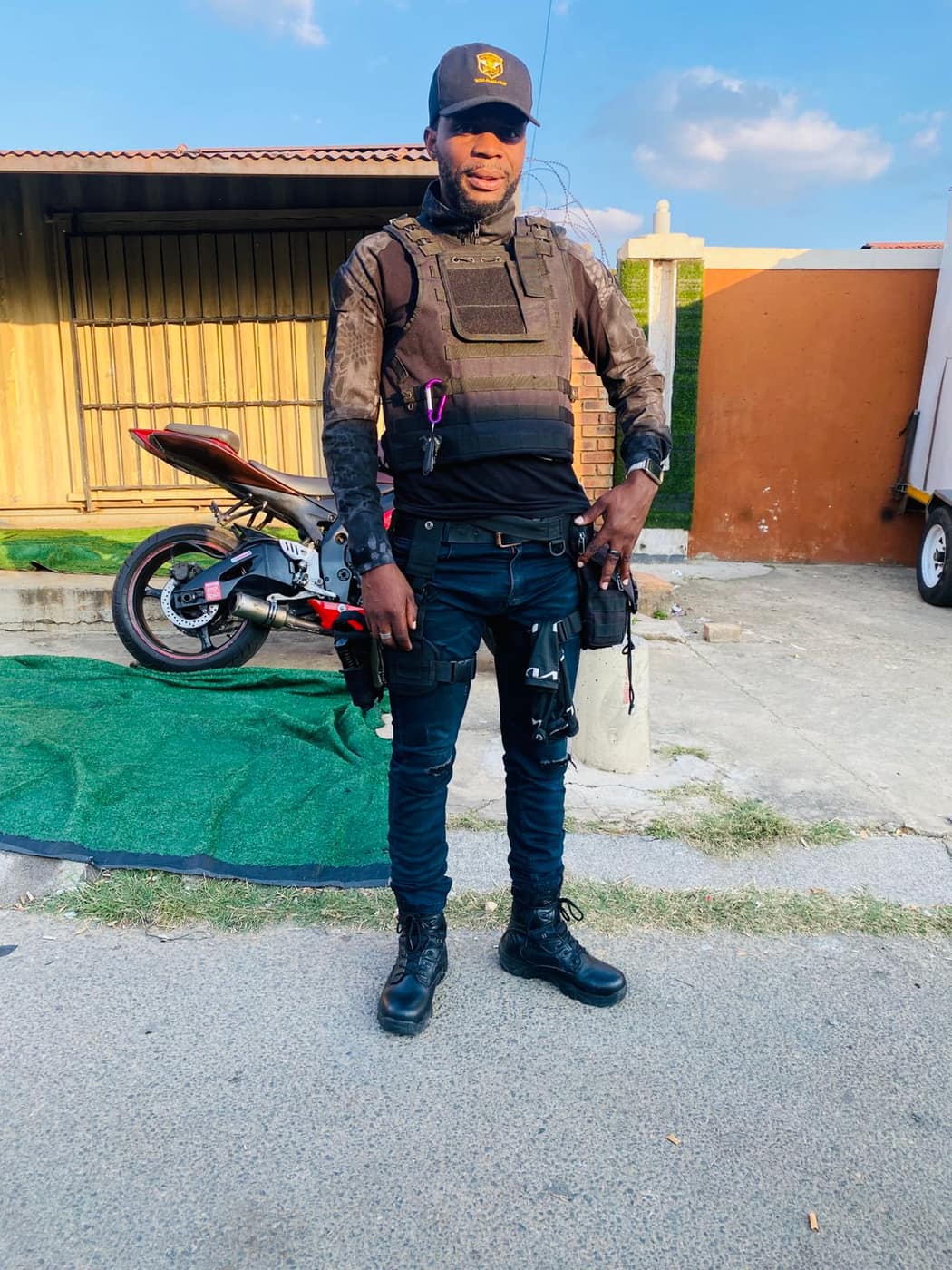 Armed officer in body armour on standby