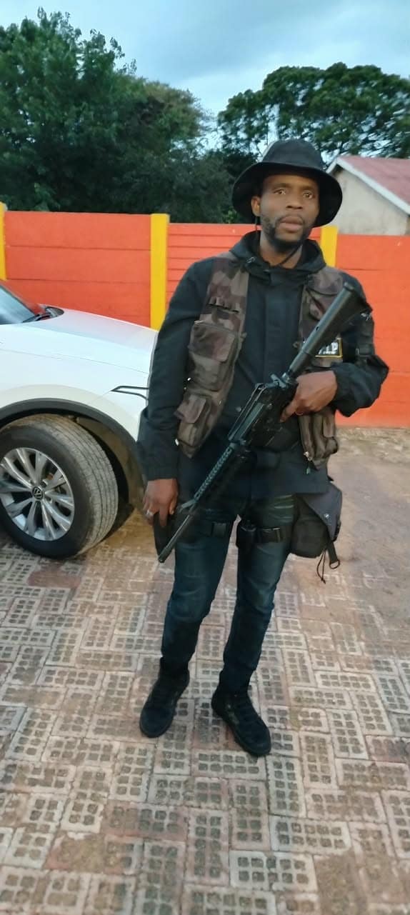 Armed officer holding a static post