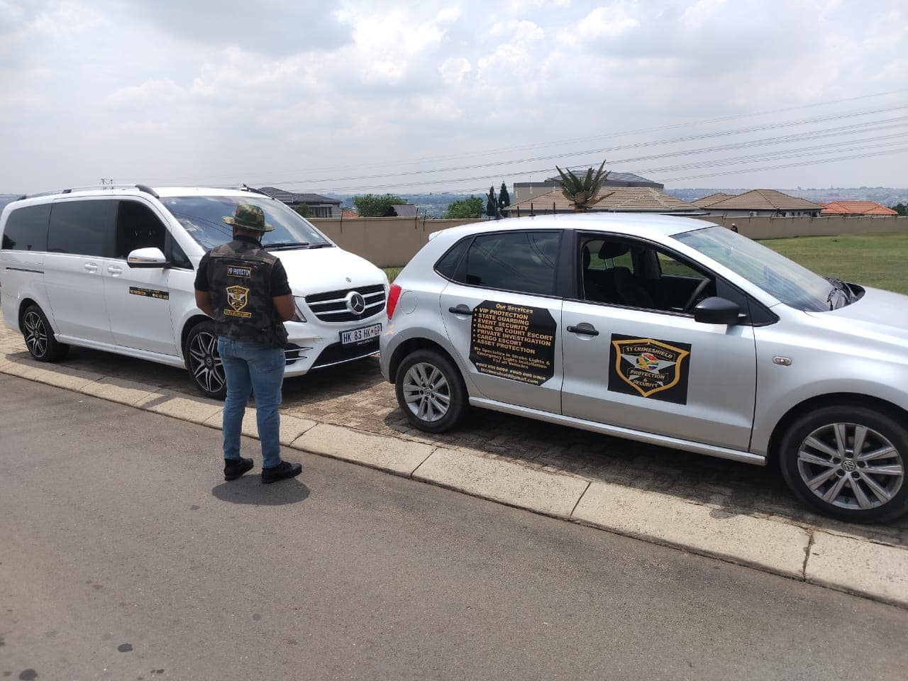 Officer between the V-Class and a branded response vehicle