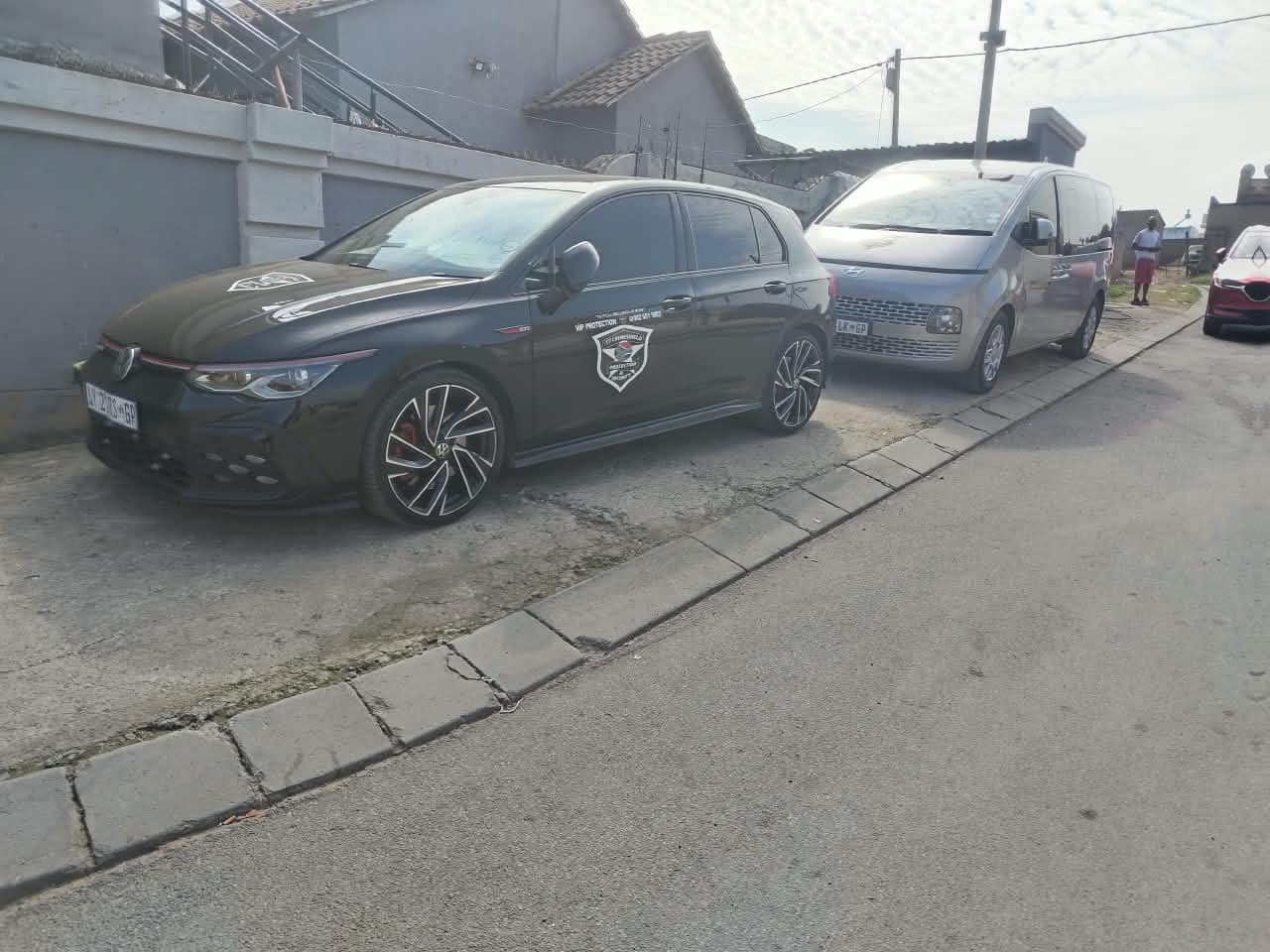 Escort vehicle and van staged for a client movement