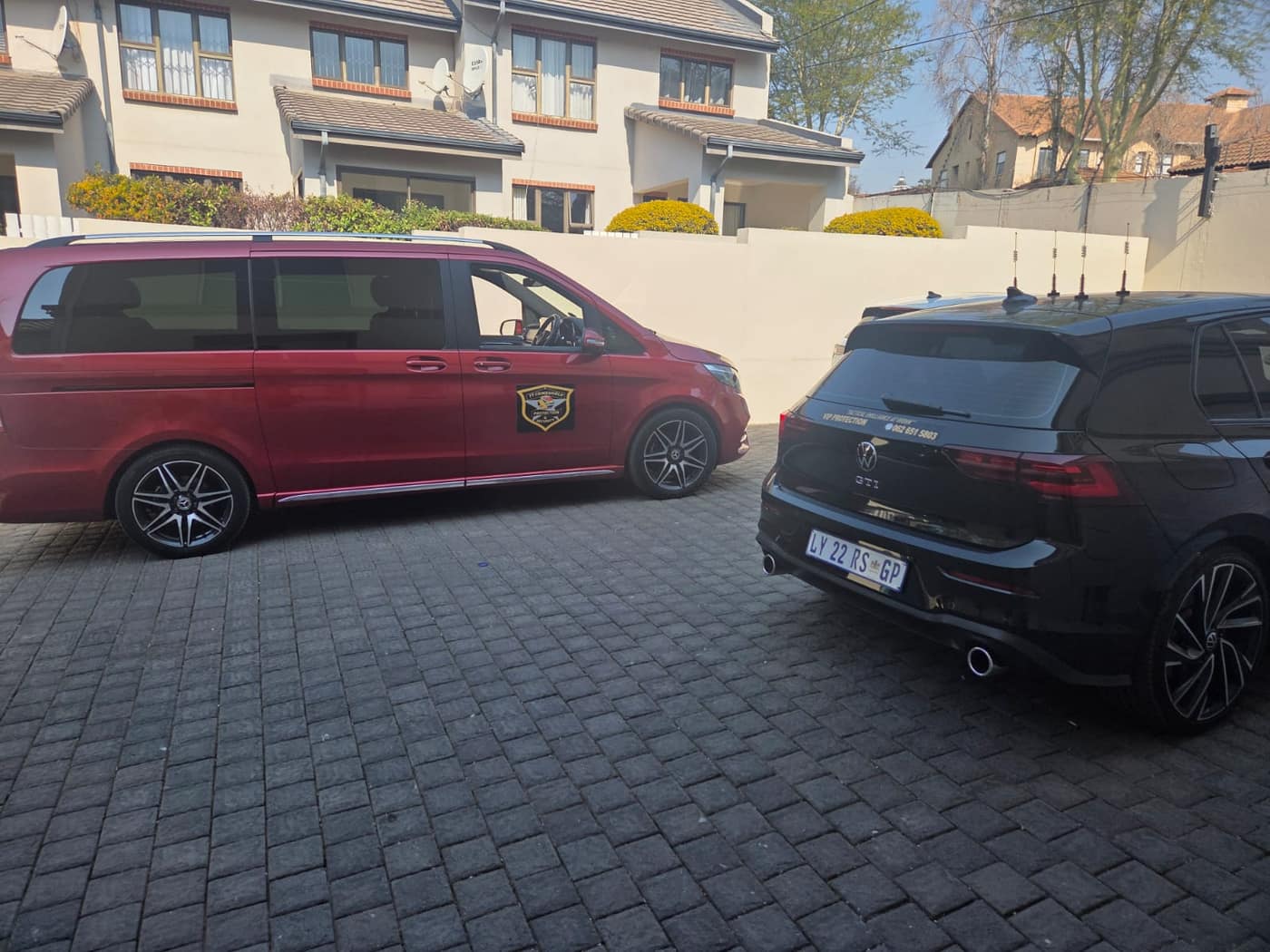 V-Class and escort vehicle at a secure complex